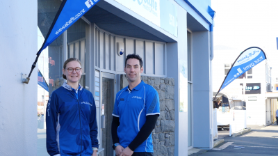Absolute Health And Fitness image of two staff members in front of gym